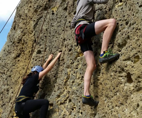 Two climbers scaling a climb at CastleRock Adventure in Wharapapa South